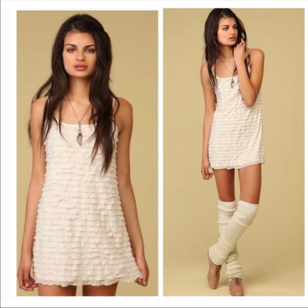 Free People NEVER WORN mini dress with ruffles. Ivory with a little bit of gold.